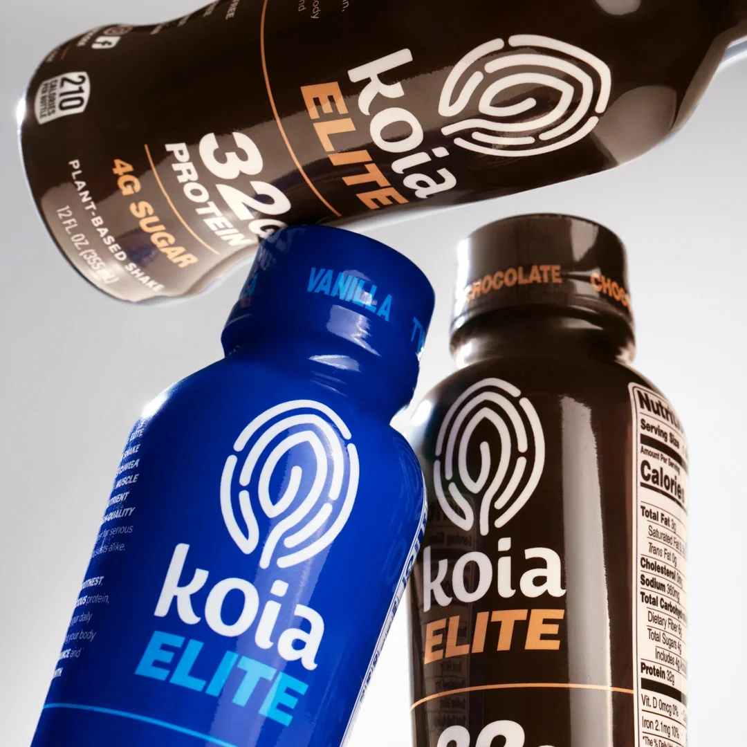 Group of Koia Elite protein shake bottles in multiple flavors